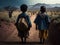 poor child travelers on an arduous path in the African desert