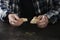 Poor elderly man with bread at table, focus