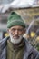 Poor old man on the street in mountain village Leh, Ladakh region, north India, close up