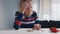 Poor old woman counting coins on the table. Hopeless elderly lady with financial problems