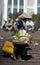 A poor woman in busy market in Vietnam