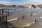 Poor wooden houses and footbridges on stilts. Coastal landscape