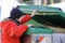 Poor young boy tries to eat into the waste box