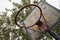 A poorly maintained basketball hoop on a village playground