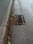 Poorly maintained blocked roadside drain causing flooding risk