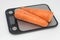 Poorly washed carrots lie on the kitchen electronic scales, carrots deteriorate, calorie counting, proper nutrition.