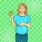 Pop art background is green. Pregnant woman on the ninth month. Holds an apple in his hand. Vector illustration, retro