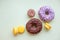 Pop Art Color style donuts, macarons and bakery goodies on bright colorful background.Minimalistic concept of donuts and