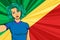Pop art girl with unicorn color hair style. Young fan girl makes selfie before the national flag of Congo. Vector sport illustrati