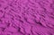 Pop art style magenta colored desert sand ripple patterns for background