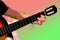 Pop art stylization of guitarist photography,man plays guitar, close-up hands, concept of creativity, learning to play musical