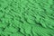 Pop art surreal style shamrock green colored unique desert sand ripple patterns for background