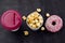 pop corn , coffee and donut on a black background