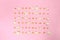 Pop corn seeds symmetric on pink paper