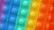 Pop it game for children. Close-up of colorful pop it rotates. A popular trend in games. relieve stress with pop it game. Game for