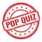 POP QUIZ text on red grungy vintage round stamp