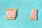 Pop tart, broken, overhead flat lay shot on a blue background