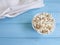 Popcorn on blue wooden towel fast