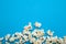 Popcorn border isolated on blue background, clipping path