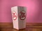 Popcorn in carboard box on pink backround