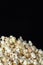 Popcorn close up with black background for text copy