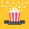 Popcorn. Film strip ribbon. Red yellow box. Cinema movie night icon in flat design style. Yellow background.