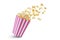 Popcorn flying out of pink white striped paper box, isolated on white background