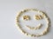 Popcorn laid out in the shape of a smiley, on a white background