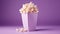 Popcorn for movie, cinema. Popcorn in pink bucket isolated on purple background. Banner pop corn salty cheese fast food snack