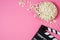 Popcorn, movie clip on pink background top view, copy space