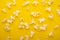 Popcorn pattern, texture on a yellow background. Top view, entertainment, movie