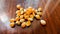 Popcorn seeds on wooden background.