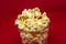 Popcorn is a snack that is a small portion of food generally eaten between meals.