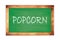 POPCORN text written on green school board