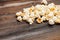 popcorn on a wooden table snack entertainment while watching a movie