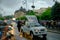 Pope Francis waving to the people on Victory Avenue from his popemobile, late afternoon with heavy rain