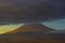 Popocatepetl active volcano, blue sunrise clouds on top