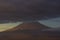 Popocatepetl active volcano, blue sunrise clouds on top