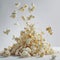 Popped popcorn kernels exploding upwards, captured mid-air, with a white background. A dynamic and delicious snack for