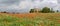 Poppies field around a rural country house