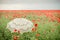 Poppies field with umbrella. Artistic interpretation