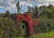 Poppies and soilders made from on a hedge against a moody sky