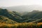 Poppies with view of green hills and mountains at Walker Canyon, in Lake Elsinore, California