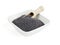 Poppy seed in bowl with wooden shovel