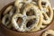 Poppy seed coating dried bagels on the table