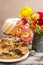 Poppy seed easter cake and bouquet of ranunculus flowers