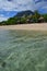 Popular Beach Resort at Le Morne, Mauritius with very clear water and Le Morne Brabant Mountain in the background