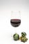 Popular british christmas drink, glass of vintage ruby port wine and christmas tree decoration