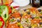Popular colorful ingredients as like tomatoes, cheese, mushroom, capsicum, olives and other ingredients baked healthy Pizza