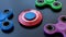 Popular colourful fidget spinner toy on a black background